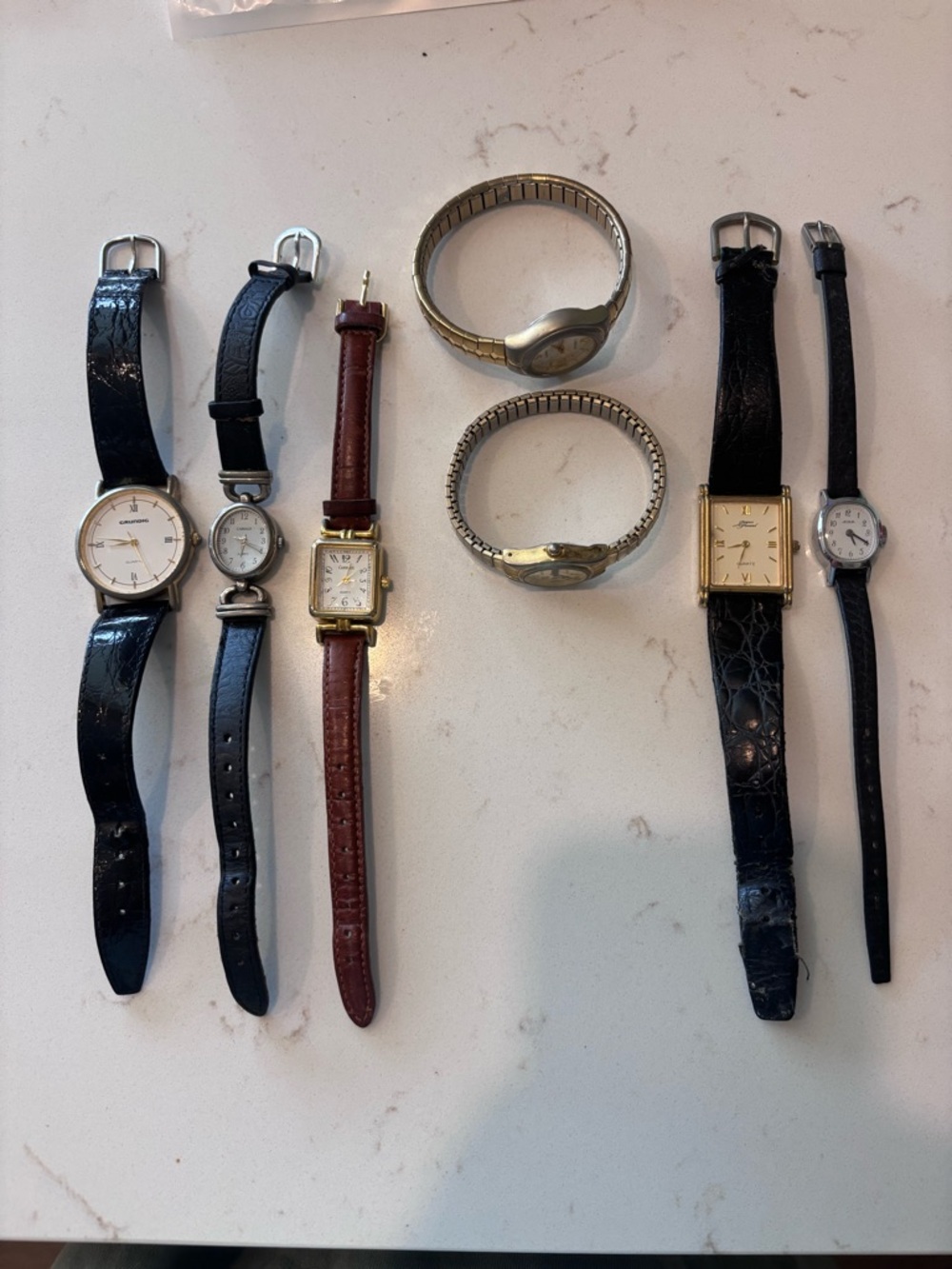 7 vintage watches.  As-is